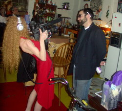  The Porn Star Shoots the Filmmaker at the Speakeasy. Notice the Filmmakers priestly collar and cigarette tucked neatly behind his ear. Notice the Porn Stars bitchin biceps!