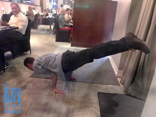 Lou Corona does a handstand for us right in the middle of the restaurant. Photo: Be*Live
