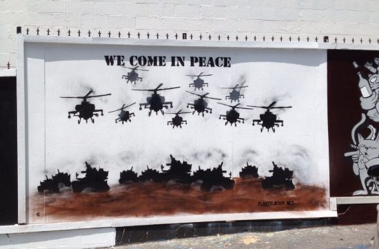 "We Come In Peace." Anti-War Street Art by Plastic Jesus