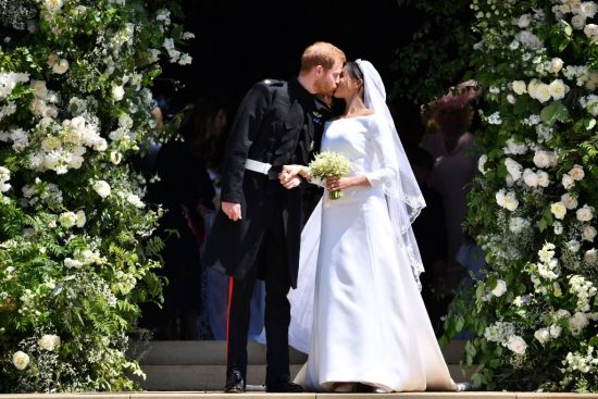 Prince Hairy marries beautiful "bi-racial" Cougar wearing white trash bag with sleeves. 
