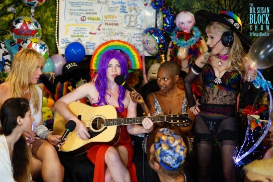Jezebel Sweet sings "No Angel," her purple hair halo'ed by a rainbow. Photo: Capture It