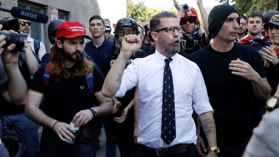 Gavin McInnes is surrounded by supporters after speaking at a rally Thursday, April 27, 2017, in Berkeley, CA. (AP File Photo/Marcio Jose Sanchez)