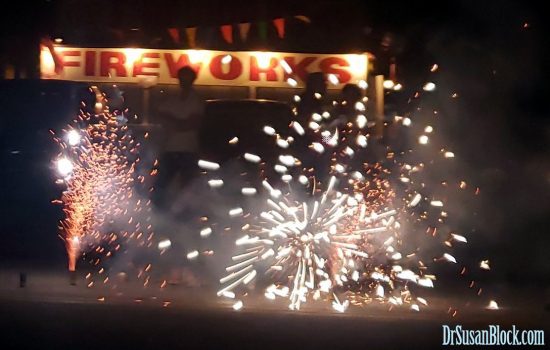 Street firecrackers exploding in front of makeshift FIREWORKS stand. Photo: Author