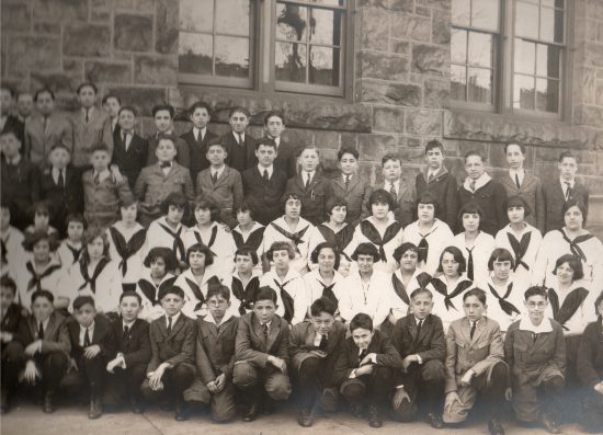 Morris Block, just a few years after surviving the Influenza of 1918, sixth from left in front row, wearing glasses.